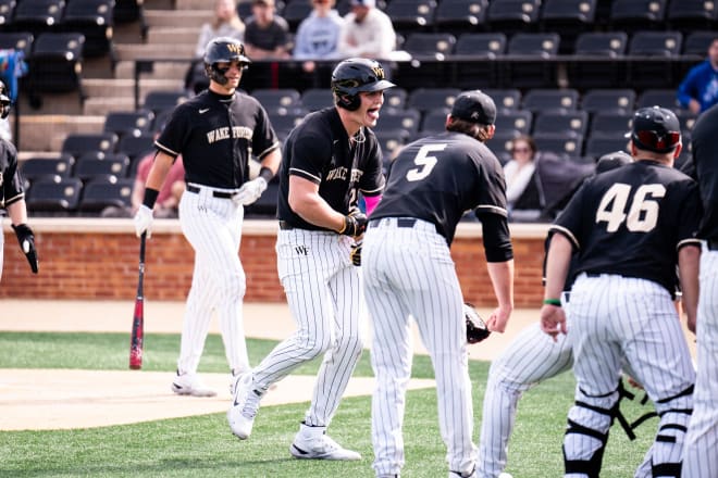 Wake Forest's Brock Wilken, middle, celebrates after hitting a home run in Sunday's win over Mount St. Mary's. 