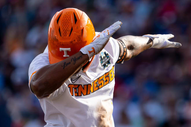 Jun 14, 2024; Omaha, NE, USA; Tennessee Volunteers second baseman Christian Moore (1) celebrates after hitting a triple against the Florida State Seminoles during the first inning at Charles Schwab Filed Omaha. Mandatory Credit: Dylan Widger-USA TODAY Sports