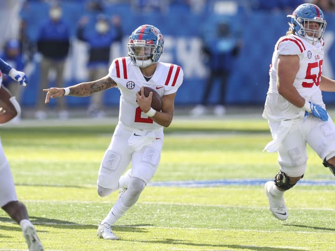 Ole Miss' Matt Corral (2) and Jonathan Mingo (1) leave the field following the Rebels' 35-28 loss to Auburn last Saturday in Oxford, Miss.