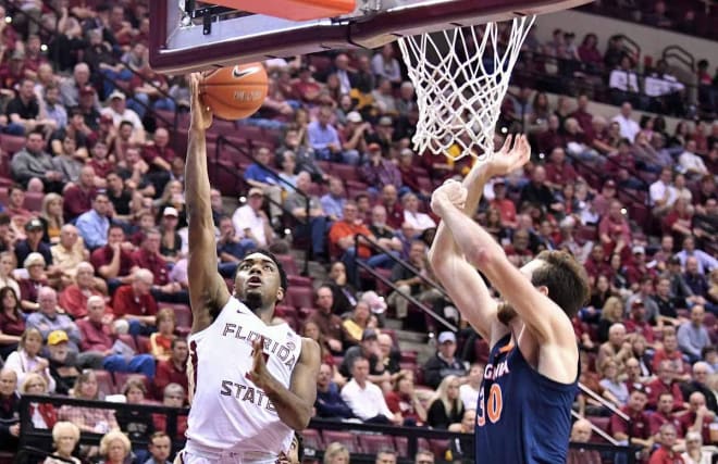 FSU senior guard Trent Forrest drives in for a layup Wednesday night against Virginia.