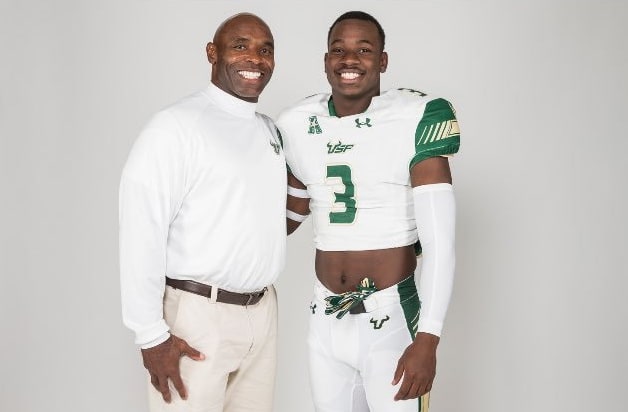 Charlie Strong and Jajuan Cherry poses during Cherry's official visit