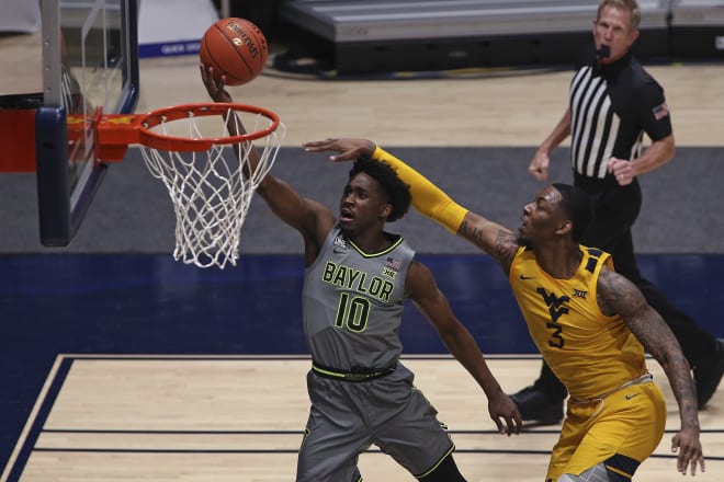 Baylor guard Adam Flagler and West Virginia forward Gabe Osabuohien