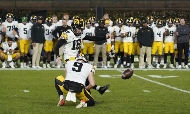 Nov 4, 2023; Chicago, Illinois, USA; Iowa Hawkeyes place kicker Drew Stevens (18) kicks the game winning field goal against the Northwestern Wildcats during the second half at Wrigley Field. Mandatory Credit: David Banks-USA TODAY Sports