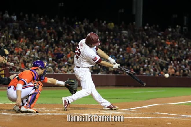 John Jones swings at a pitch during Friday night's game. 