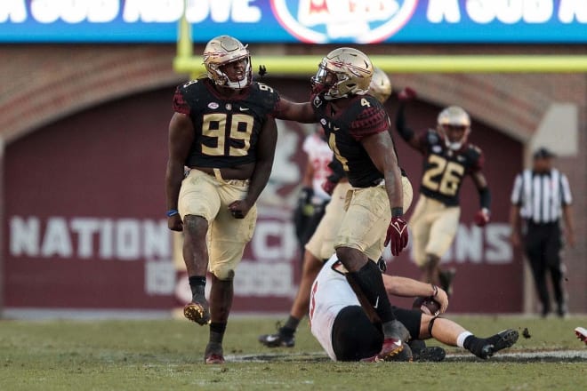 FSU defensive linemen Malcolm Ray and Keir Thomas celebrate a sack Saturday vs. N.C. State.