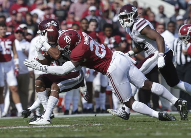  Mississippi State Bulldogs wide receiver Keith Mixon (23) is hit by Alabama Crimson Tide linebacker Shaun Dion Hamilton (20) at Bryant-Denny Stadium. Photo | USA Today