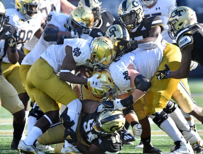 Notre Dame tries to run the ball against the Jacket defense 