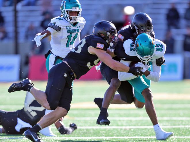 Army DL Cody Winokur (93) takes down Coastal Carolina Jameson Tucker (82)