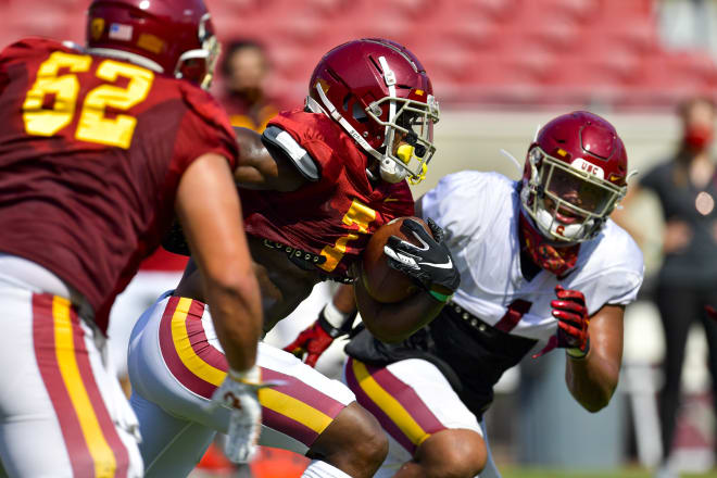 Senior running back Stephen Carr finds a crease during USC's first preseason scrimmage in the Coliseum on Saturday morning.