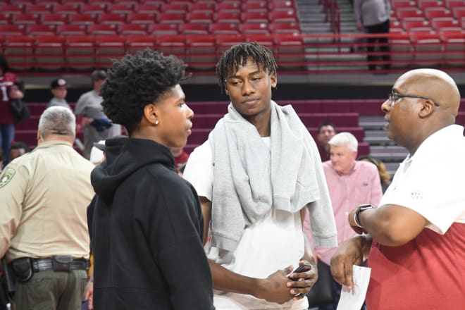 2021 shooting guard target Jaxson Robinson with Arkansas commit KK Robinson and coach Corey Williams.