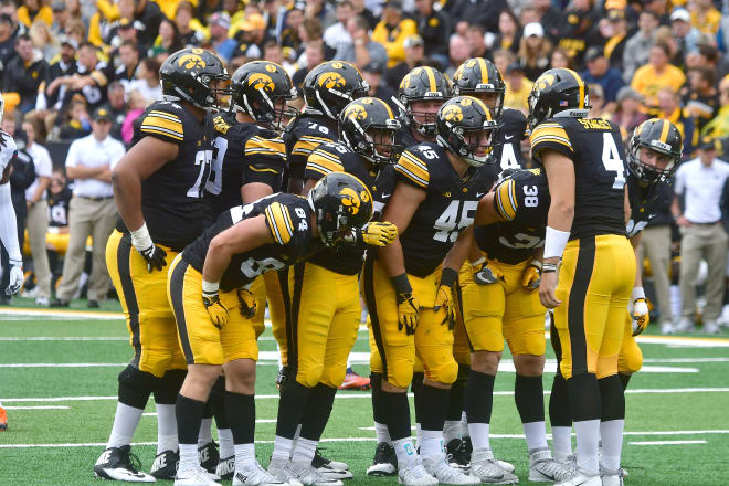 Iowa Hawkeyes' quarterback Nathan Stanley (4) huddles with his teammates during a Big Ten Conference football game between the Illinois Fighting Illini and the Iowa Hawkeyes on October 07, 2017, at Kinnick Stadium, Iowa City, Ia.