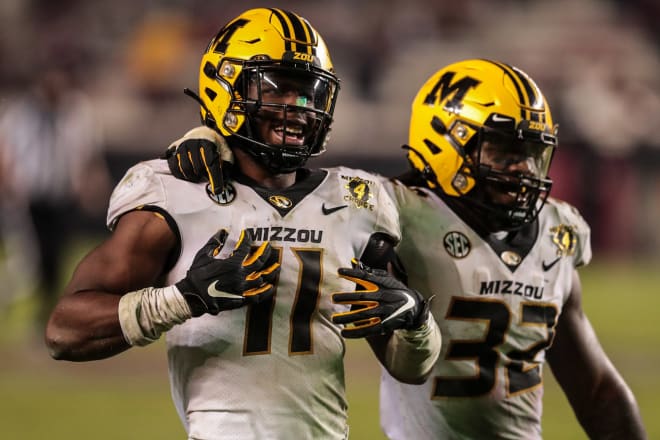 Devin Nicholson (11) will be back at middle linebacker for Missouri this season while the Tigers look to replace all-American Nick Bolton (32).