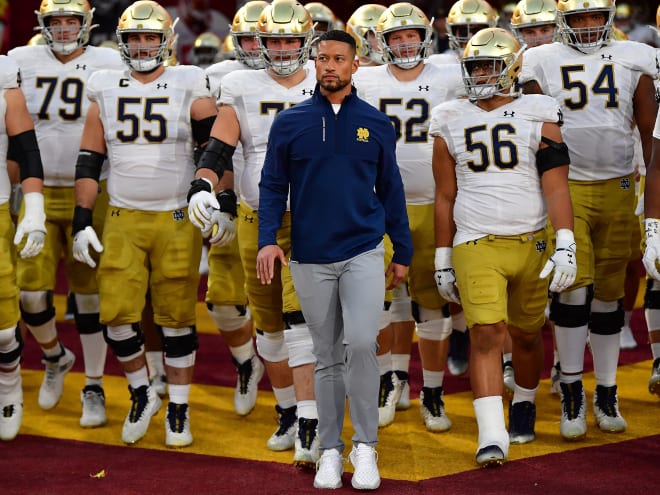 Notre Dame head coach Marcus Freeman leads the Irish out of the tunnel at LA Memorial Coliseum. 