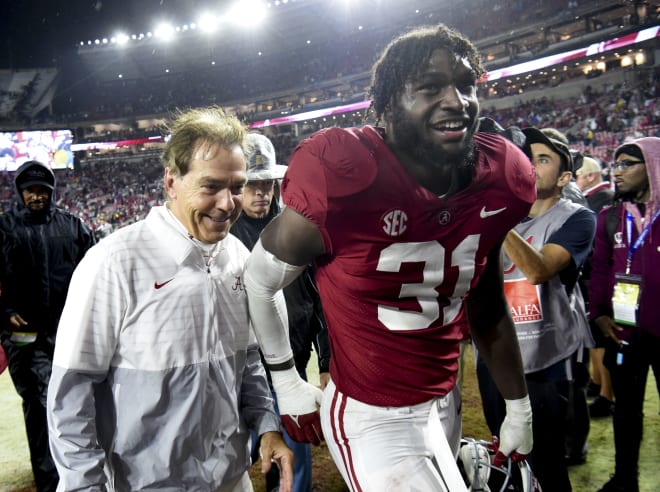 Alabama Crimson Tide head coach Nick Saban and linebacker Will Anderson Jr. (31) share a smile as they leave the field after defeating the Auburn Tigers at Bryant-Denny Stadium. Alabama won 49-27. Photo | Gary Cosby Jr.-USA TODAY Sports