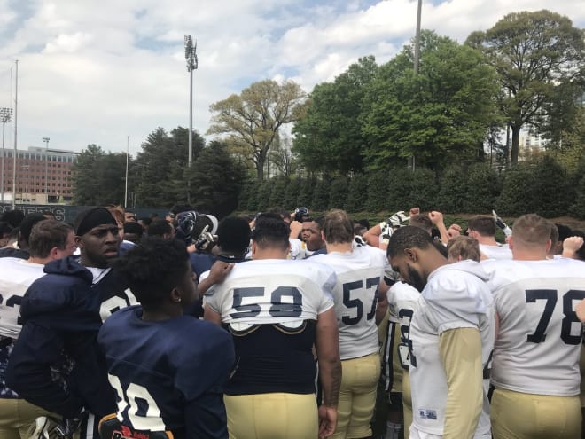 Jackets huddling after practice 