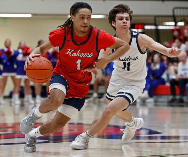 Kokomo Wildkats guard Zion Bellamy (1) drives past Harrison Raiders Ray Gibson (11) during the IHSAA boy s basketball sectional game, Tuesday, Feb. 27, 2024, at Lafayette Jeff High School in Lafayette, Ind.