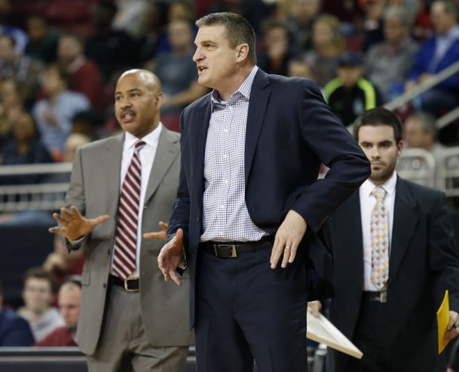 Stan Heath (Left) coaches next to Eagles head coach Jim Christian (AP Images)