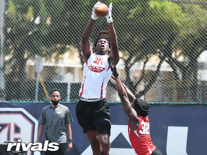 Domineck reaches up over a defender for a ball at the Rivals Camp in Miami last year