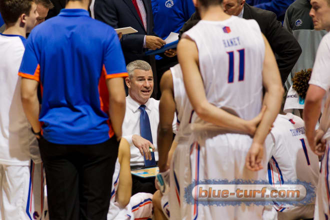 Boise State head coach, Leon Rice talks with the team during a time-out.
