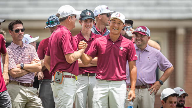FSU golf coach congratulates star John Pak.