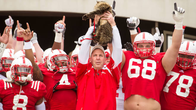 Bo Pelini entered the field for the 2014 spring game carrying a cat out of the Tunnel, to poke fun at internet personality Faux Pelini.