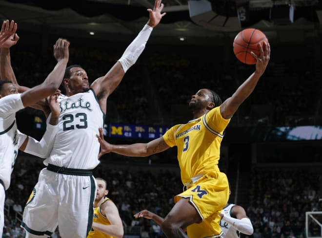 Michigan Wolverines basketball senior point guard Zavier Simpson had 14 points and eight assists in the game.
