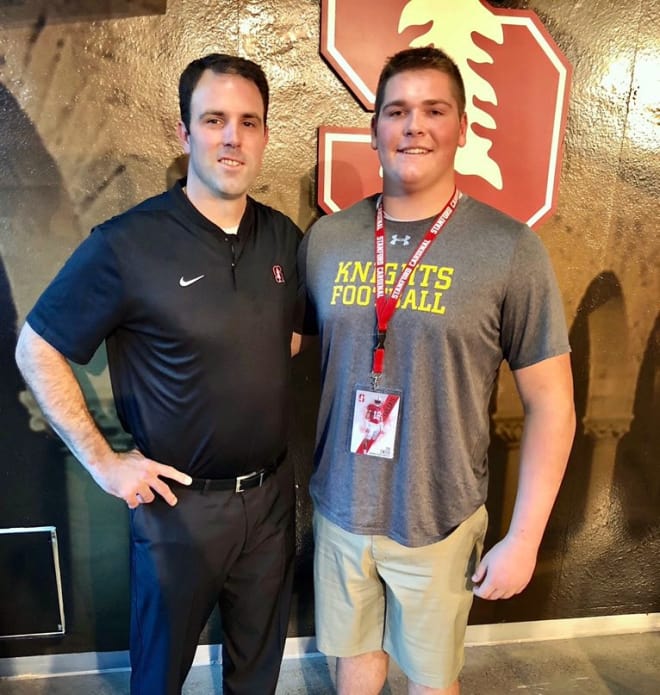 Stanford offensive line coach Kevin Carberry and junior tackle Zak Zinter pose for a photo before the Cardinal played Utah.