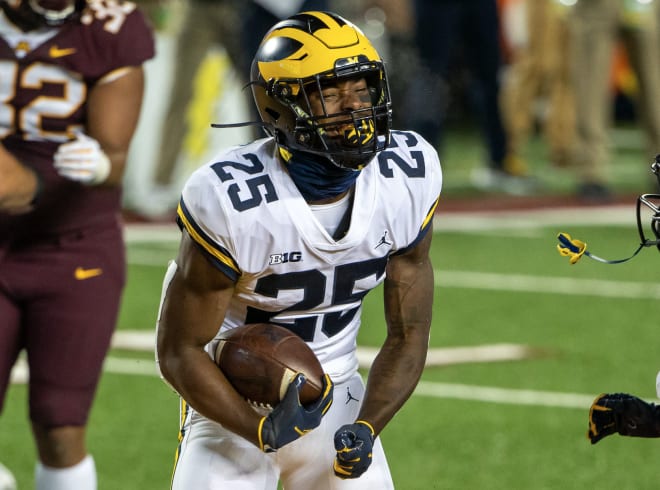 Michigan Wolverines Football running back Hassan Haskins celebrates one of his two touchdowns in a win over Minnesota.