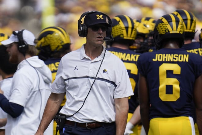 Michigan Wolverines head football coach Jim Harbaugh picked up his 52nd win as U-M's head man.