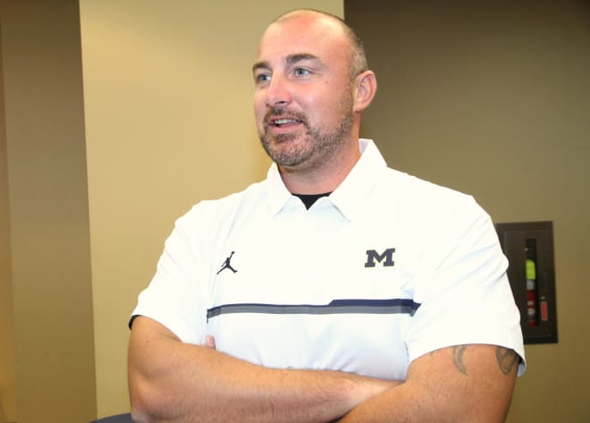 Michigan assistant Chris Partridge. 