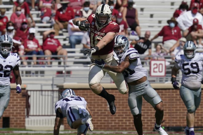 Kansas State's Jahron McPherson (31) wraps up Oklahoma's Austin Stogner (18) 