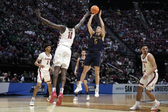 Irish guard Cormac Ryan (5) shoots over Alabama center Charles Bediako (10) on his way to a career-high 29 points Friday in NCAA Tournament action at Viejas Arena in San Diego. 