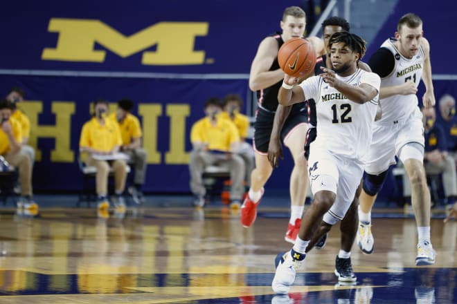 Michigan Wolverines basketball fifth-year senior guard Mike Smith is dishing out five assists per game.