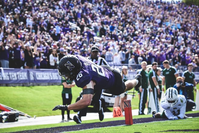 Evan Hull dives into the end zone for one of his seven touchdowns in 2021.