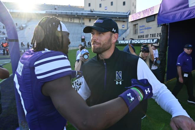 Interim coach/defensive coordinator David Braun, right, embraces defensive back Devin Turner after winning last weekend against UTEP. 