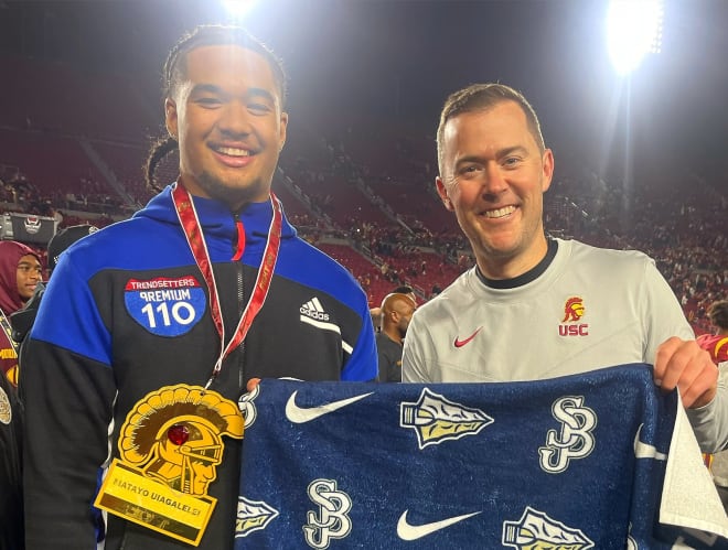 Rivals100 edge rusher Matayo Uiagalelei with USC coach Lincoln Riley after the Trojans' win over Notre Dame on Saturday.