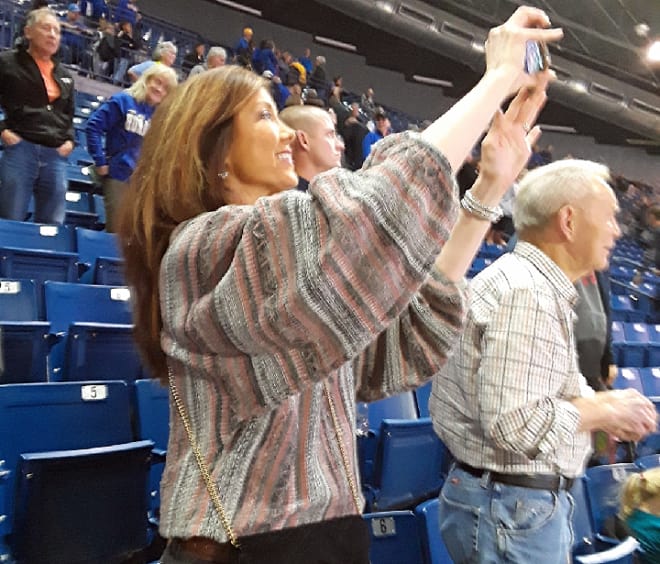 Kim Stout, Curran Scott's mother, captures Tulsa's on-court celebration after the game.
