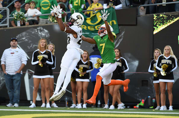 EUGENE, OR - SEPTEMBER 24: Defensive back Ahkello Witherspoon #23 of the Colorado Buffaloes intercepts a pass intended for wide receiver Darren Carrington II #7 of the Oregon Ducks late in the fourth quarter of the game at Autzen Stadium on September 24, 2016 in Eugene, Oregon. Colorado won the game 41-38. (Photo by Steve Dykes/Getty Images)