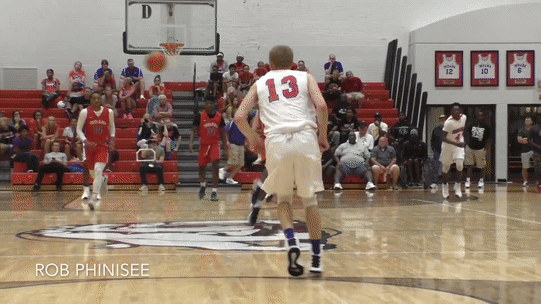Rob Phinisee uses a nice move to fake out this senior defender for a layup.