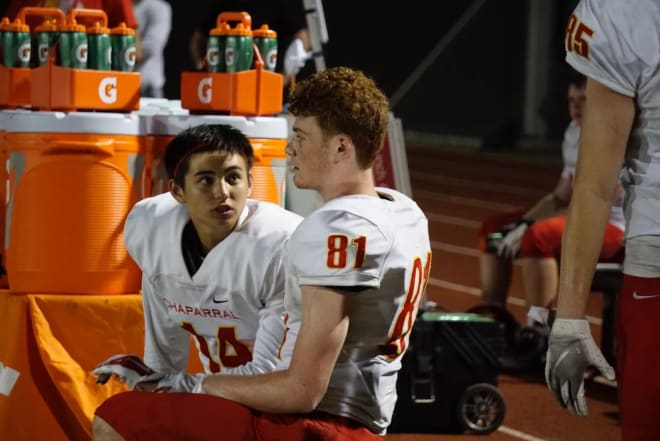 Chaparral receivers Christian Cervantes (left) and Tommy Christakos (right) on the sidelines during a road game from last season.  Six players that caught passes for the Firebirds last year return in 2019. (Photo by Ralph Amsden)