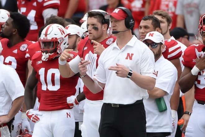 Matt Masker and Scott Frost signaling a play