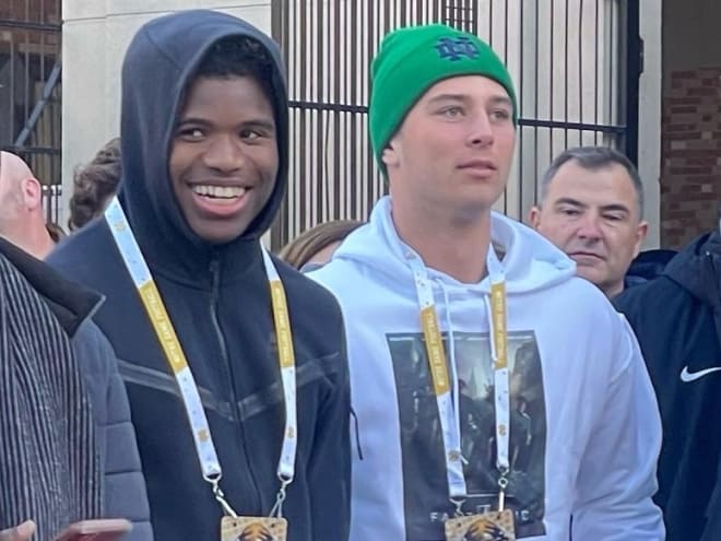 2024 class five-star wide receiver Ryan Wingo (left) and four-star quarterback CJ Carr hang out at Saturday's "Victory March."