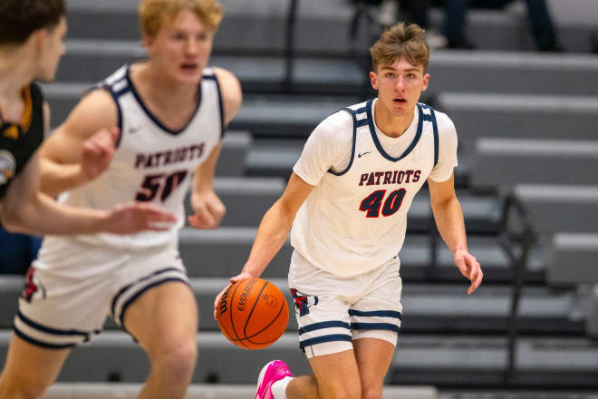 Heritage Hills High School junior Trent Sisley (40) brings the ball up court during the first half of a varsity game against Evansville Christian High School in the SNKRS4SANTA Shootout, Saturday, Dec. 2, 2023, at Brownsburg High School.