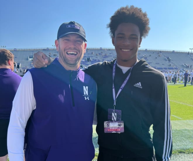 Matthew Smith poses with interim head coach David Braun before Northwestern's game against Penn State on Saturday.