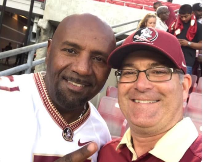 Frederick Brown (left), the father of FSU linebacker Josh Brown, meets a fan after interacting on Twitter.