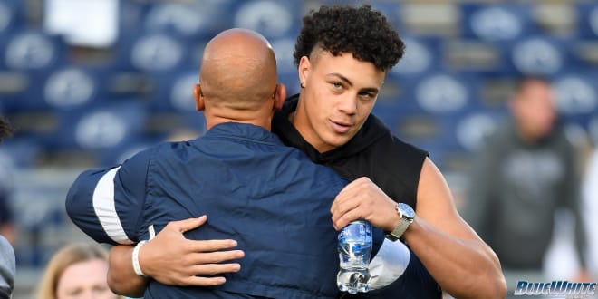 Class of 2020 TE Theo Johnson embraces James Franklin before the game against Buffalo last month. 