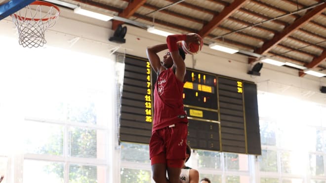 Brandon Miller goes up for a dunk