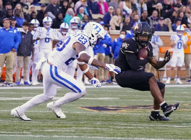 Lummie Young IV, left, tries to tackle Wake Forest's Ke'Shawn Williams earlier this season. 