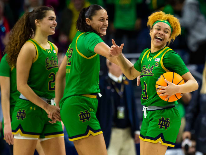 Notre Dame guard Hannah Hidalgo, right, celebrates with forwards Kylee Watson, center, and Maddy Westbeld during a win over Virginia Tech in February.