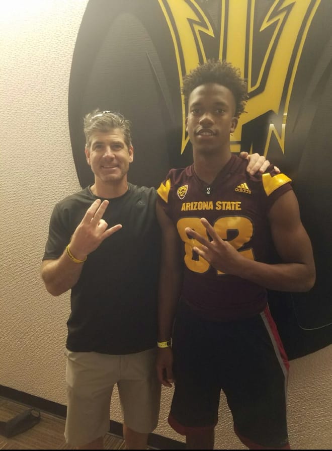 Offensive coordinator Rob Likens with Geordon Porter on his visit